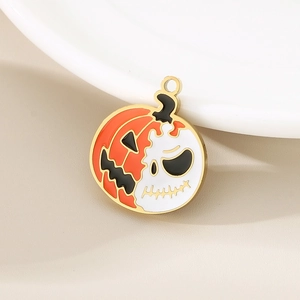 Macro detail of Jack Skellington pumpkin charm with gold edges on white ceramic