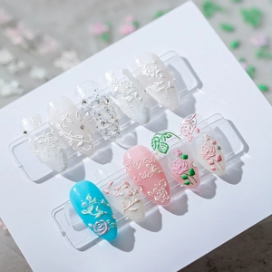 3D floral embossed nail stickers with white roses and pink petals on clear backing