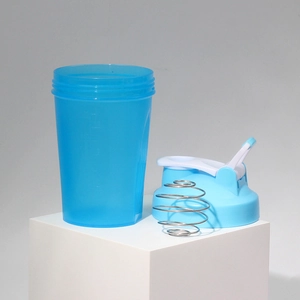 Blue protein shaker bottle with stainless steel whisk ball and measuring scale for fitness
