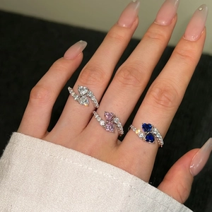 Close-up of S925 silver Toi et Moi heart stone rings with pink and blue zircons