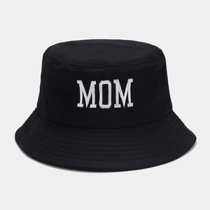 Close-up of white MOM embroidery on a black cotton bucket hat with detailed stitching