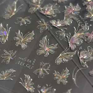 Macro shot of iridescent butterfly nail stickers with holographic shell luster finish