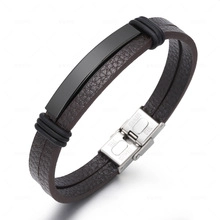 Detail of men's leather bracelet showing double-layer texture and black metal plate