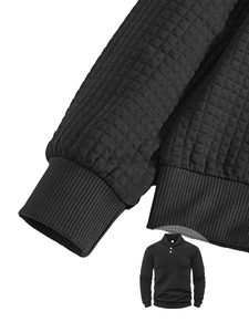 Detail of black waffle knit polo with shawl collar, buttons and ribbed sleeve cuffs