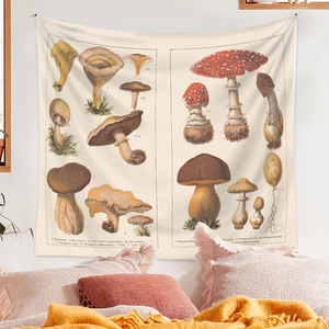 Detail of bohemian mushroom tapestry with vintage botanical illustrations on bedroom wall