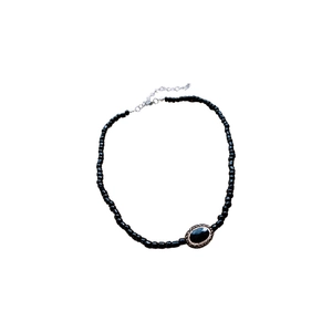 French vintage necklace with black crystal beads and oval gemstone pendant on white background