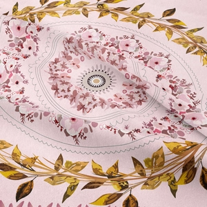 Close-up of pink floral mandala tapestry showing woven fabric texture and soft drapes