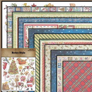 Close-up of retro Christmas scrapbook paper with vintage Santa and music notes patterns