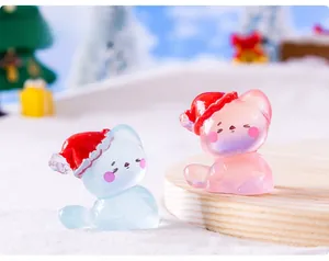 Macro shot of luminous miniature Christmas cats in resin for DIY fairy garden scenery