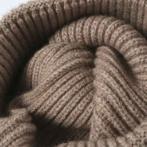 Thick brown jacquard knit beanie for men and women featuring warm textured ribbing