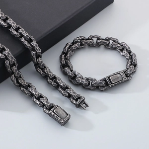 Macro detail of vintage hammered texture on stainless steel chain set with box