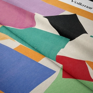 Close-up of soft bohemian tapestry fabric with colorful abstract geometric patterns