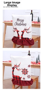 Detail of Christmas linen chair covers with red plaid ruffles and reindeer print