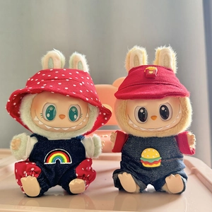 Detail of two Labubu plush dolls wearing rainbow and burger denim overalls and hats