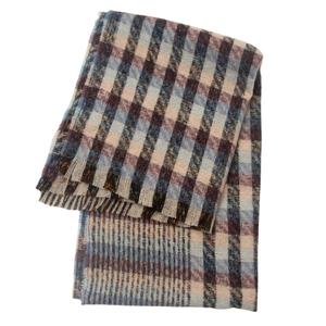 Close-up of navy and red plaid scarf featuring soft brushed texture and fringed edges