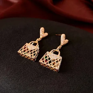 Elegant gold zircon earrings featuring heart-shaped studs and colorful handbag pendants