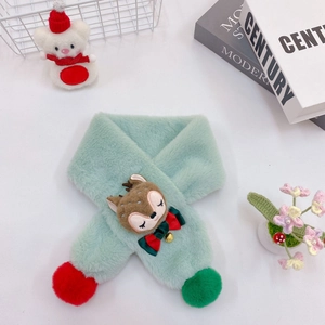Detail of green plush kids scarf with a cute reindeer head and festive velvet pom-poms
