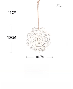 Detailed view of laser-cut wooden snowflake ornaments with natural grain and jute twine hanger