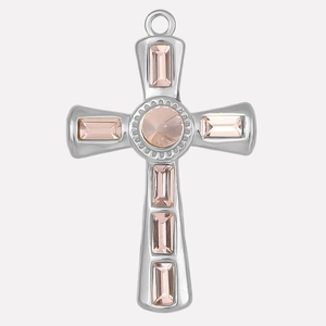 Macro shot of 304 stainless steel cross pendant with pink baguette crystals
