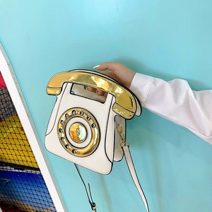 Macro detail of white PU crossbody bag in creative vintage rotary telephone dial design