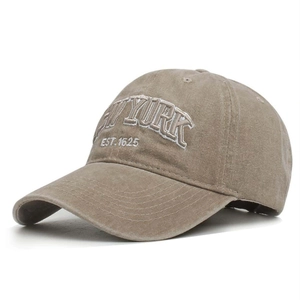 Detailed close-up of NEW YORK 1625 3D white embroidery on khaki washed cotton baseball cap