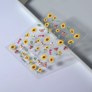 Sunflower and butterfly nail art stickers with embossed detail on a clear sheet