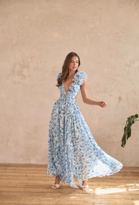 Detail of floral maxi dress with deep V-neck, waist cut-outs and ruffle sleeves