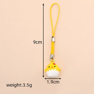Detail showing dimensions of yellow chick bell pendant with 1.9cm width and 9cm length