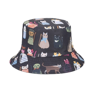 Reversible bucket hat with all-over colorful cartoon cat print on a black base