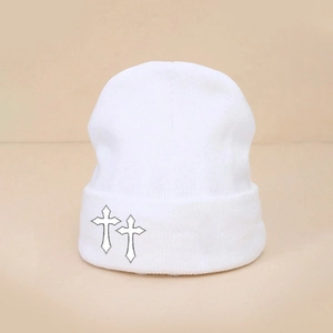 White knitted beanie with black outline cross embroidery and folded brim for winter