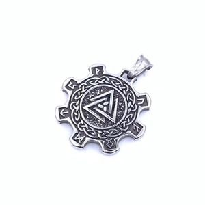 Detail of silver Viking Valknut pendant with Celtic knots and Nordic runes engraving