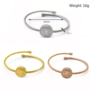 Detail showing twisted stainless steel bangle bracelets in silver, gold, and rose gold finishes