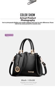 Macro shot of black PU leather handbag with golden hardware and circular logo pendant