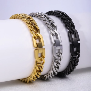 Detailed view of gold, silver, and black Cuban chain bracelets with unique metal clasps