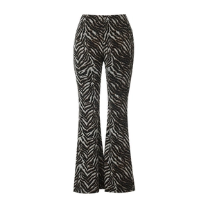 Close-up of zebra pattern flare pants with rhinestones in brown and black hues