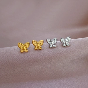 Minimalist titanium steel butterfly stud earrings in gold and silver finish with hollow design