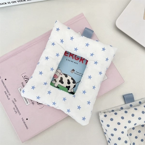 Detail of soft plush card holder with blue star pattern and convenient top hanging loop