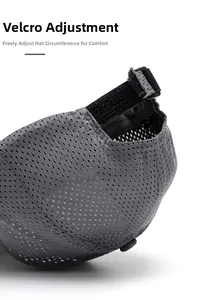 Detail of adjustable velcro strap and breathable mesh fabric on dark grey baseball cap