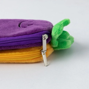 Detailed macro view of soft plush fabric texture and sturdy silver metal zipper on cases