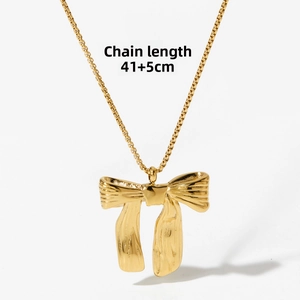 Detail view of gold bow necklace showing 41 plus 5 cm adjustable chain length design