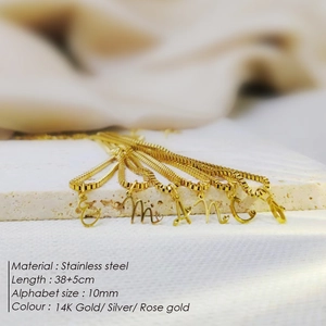 Detailed view of stainless steel initial necklaces with 14K gold plating and box chain