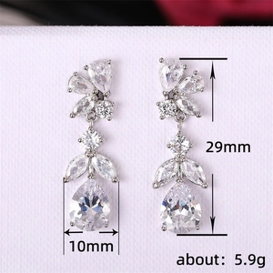 Silver flower drop earrings with leaf-shaped zircons, measuring 29mm by 10mm