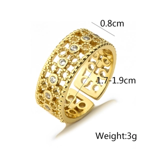 Detailed view of adjustable gold-plated hollow ring with cubic zirconia stones and measurements