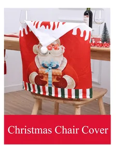 Close-up of a festive red Christmas chair cover with Santa Claus and pom-pom detail