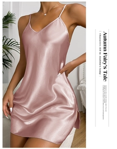Detail of pink satin sleepwear showing the V-neck design and delicate side slit texture