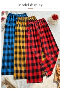 Detailed flat lay of plaid wide-leg lounge pants in blue, yellow and red colors