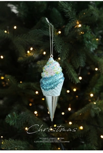 Detail showing an ice-blue ice cream shaped Christmas ornament with glitter and silver base