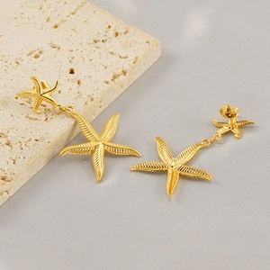 Golden double starfish earrings on stone base, retro ocean style stainless steel jewelry