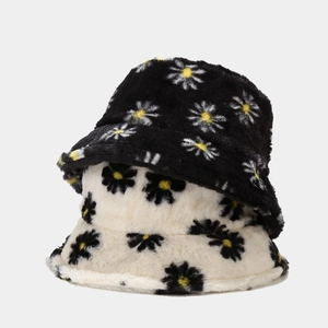 Fuzzy daisy bucket hats in black and beige plush faux fur for winter warmth