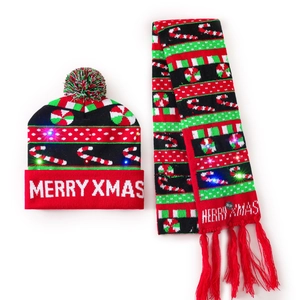 Detail view of the LED light-up knitted Christmas hat and scarf set with Merry Xmas letters